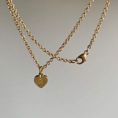 A subtle, resolute diamond heart to keep close to your own. 18k yellow gold Diamond, 0.54ct SII, 5mm x 4mm (1/4" x 3/16")Chain is 18" long Yellow Gold Oval Jewelry With Heart Charm, 14k Yellow Gold Heart Necklace With Delicate Chain, Delicate Yellow Gold Heart Necklace, Minimalist Yellow Gold-plated Heart Necklace, Minimalist Yellow Gold Heart Cut Jewelry, Minimalist Yellow Gold Plated Heart Necklace, Minimalist Yellow Gold Heart Cut Necklace, Delicate 14k Yellow Gold Heart Necklace, Yellow Gold Heart Cut Necklace With Delicate Chain