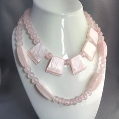 "This is such a fun set of pastel pink jewelry. Includes 2 necklaces and one bracelet. Each piece a matte finish and a pearlescent shimmer. Necklaces - 25\" and 18\" Bracelet - 7.5\" - stretches to 8.5\" to slip over hand Feel free to email me with any questions. Free domestic shipping. Additional Information: * All jewelry items come securely packaged and are mailed promptly upon payment - often same-day. * The majority of my vintage items are used and may show some wear. Please review all phot Pastel Pink Jewelry, Pink Necklace Set, Mid Century Pastel, Trending Photos, Bellingham Wa, Gold Cross Necklace, Plastic Jewelry, Pink Jewelry, Pink Necklace