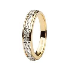 an 18k gold wedding ring with diamonds on the sides and two hearts in the middle