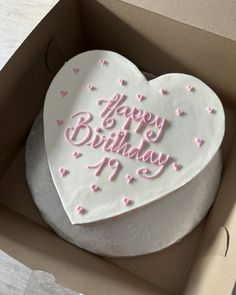 a heart shaped birthday cake in a box