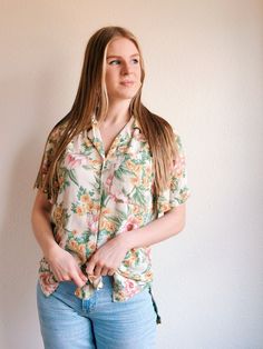 Welcome spring in this botanical floral button-up shirt! Features beautiful florals in rich colors. Try pairing it with cute light-wash denim.  Condition: good vintage condition, no notable issues. Measurements were taken with the item laying flat on the ground.  Tag Size: Small Width: 18.5 in. Length: 26 in. Keep in touch! Find us on Instagram @shopMadrone to be the first to see new items come in! Thank you! <3 Casual Hawaiian Shirt With Floral Print, Relaxed Fit, Casual Cotton Hawaiian Shirt For Spring, Spring Cotton Hawaiian Shirt, Casual Relaxed Fit Hawaiian Shirt For Spring, Relaxed Fit Hawaiian Shirt For Spring, Hawaiian Style Tops With Camp Collar For Spring, Hawaiian Camp Collar Tops For Spring, Trendy Cotton Hawaiian Shirt For Spring, Spring Collared Hawaiian Shirt