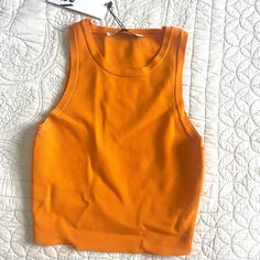 Super Bright Orange Knit Tank Top Orange Ribbed Sleeveless Top, Orange Fitted Knit Top For Spring, Casual Orange Ribbed Top, Fitted Orange Knit Top For Spring, Zara Basic Stretch Crop Top, Zara Seamless Stretch Top, Zara Stretch Seamless Tops, Casual Yellow Seamless Tops, Trendy Orange Seamless Top