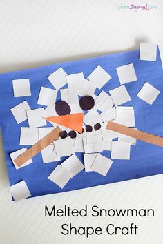 a snowman shape craft made out of construction paper and cut into squares with scissors