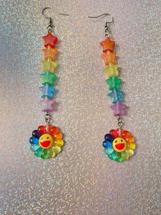 If rainbow themed jewelry is your aesthetic, then why not add some more color to your outfit? These rainbow flower earrings are so colorful and can't be missed by the human eye! A never fading rainbow that will be with you forever🌈✨. Check out our earrings section for more unique designs. *Stainless steel *2.5-3 inches long If you have any questions, please don't hesitate to ask! We are friendly:) Visit our official website: www.theyeetboutique.com for more products and follow us on Instagram: Rainbow Accessories Aesthetic, Kidcore Accessories, Rainbow Stuff, Kei Jewelry, Kawaii Bracelet, Earrings Y2k, Y2k Earrings, The Human Eye, Rainbow Flower