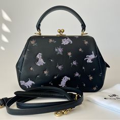 Coach Kisslock Bag Is Always Cute . This One With Disney Dalmatian Print Is Extremely Cute . It Can Hold A Lot In The Main Pocket Yet Does Look Bulky. The Bag Is In Almost New Condition. Product Details Glovetanned Leather Inside Zip And Snap Pockets Kisslock Closure, Leather Lining Handle With 3 1/4" Drop Outside Slip Pocket Detachable Strap With 22" Drop For Shoulder Or Crossbody Wear Instantly Change The Look Of Your Bag With An Interchangeable Strap. 9" (L) X 6" (H) X 3 1/2" (W) Also Available In Other Sizes Disney X Coach Disney Style No. 68932 Coach Disney, Disney 101 Dalmatians, Dalmatian Print, Bags Coach, Frame Bag, 101 Dalmatians, Disney Style, Purse Bag, Dalmatian