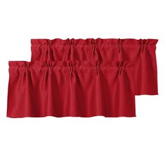 three red curtains hanging on a white wall