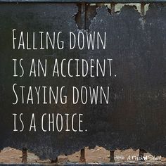 a black sign that says falling down is an accident, staying down is a choice