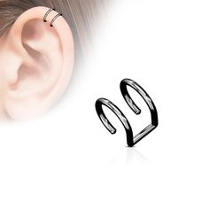 an ear piercing is shown with two black rings