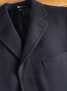 Classic Black Cashmere Wool Coat, Classic Long Coat Blazer With Hidden Button Closure, Elegant Solid Color Wool Sport Coat, Elegant Solid Wool Sport Coat, Classic Solid Wool Sport Coat, Classic Wool Sport Coat In Solid Color, Classic Winter Outerwear With Pressed Crease, Formal Cashmere Pea Coat With Lapel Collar, Formal Cashmere Outerwear With Notch Lapel