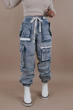 Hip Hop Denim Cargo Pants In Denim Blue, Dark Wash Utility Cargo Pants For Streetwear, Hip Hop Denim Cargo Pants, Urban Denim Blue Cargo Pants With Pockets, Urban Denim Blue Cargo Pants, Relaxed Fit Hip Hop Cargo Jeans With Multiple Pockets, Dark Wash Relaxed Fit Cargo Jeans Hip Hop Style, Relaxed Fit Hip Hop Cargo Jeans, Dark Wash Utility Cargo Jeans For Streetwear