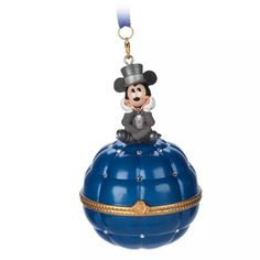 mickey mouse on top of a blue ball ornament