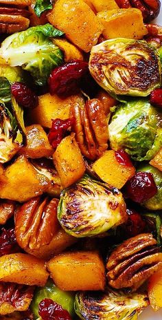 close-up of Roasted Butternut Squash and Brussels sprouts with Pecans and Cranberries International Appetizers, Brussels Sprouts With Pecans, Butternut Squash And Brussels Sprouts, Cranberry Recipes Thanksgiving, Thanksgiving Recipes Side Dishes Veggies, Thanksgiving Side Dishes Healthy, Best Thanksgiving Side Dishes, Thanksgiving Menu Ideas Side Dishes, Thanksgiving Food Sides