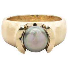 Designer: custom design Material: 18k yellow gold Tahitian Pearl: 9mm Ring Size: 8 ½ (please allow two additional shipping days for sizing requests) Dimensions: ring top measures 16.85mm by 15.54mm Weight: 12.12 grams 9mm Ring, Tahitian Pearl Ring, Black Pearl Ring, Pearl Rings, Tahitian Pearls, Black Pearl, Tahiti, Pearl Ring, 12 12