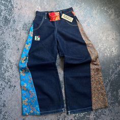 JNCO Paisley Print Denim Jeans, size 1. 65% cotton, 35% polyester, Made in USA.  Measurements:  Waist: 30"  Length: 42.5"  Inseam: 33.25"  We do our best to show all flaws of any garment through the pictures. Please check pictures for condition.    Exported By ExportYourStore :) Multicolor Wide Leg Denim Jeans, Multicolor Denim Patchwork Pants, Multicolor Denim Pants With Pockets, Multicolor Patchwork Denim Pants, Mid-rise Cotton Bottoms With Floral Print, Mid-rise Cotton Floral Print Bottoms, Mid-rise Floral Print Cotton Bottoms, Floral Print Wide Leg Denim Bottoms, Multicolor Wide Leg Cotton Jeans