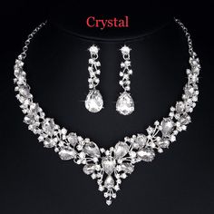 a necklace and earring set with crystal stones