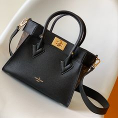 This small On My Side handbag combines soft calfskin with classic Monogram canvas side lining, with a detachable wide shoulder strap for shoulder and crossbody experience, top handle Add the option of carrying it by hand or by the elbow. Large outer pocket for easy access to items.

Size: 25.0 x 20.0 x 12.0 cm (LxHxW)
• Monogram coated canvas and calfskin
• Leather trim
• Microfiber lining
• metallic parts Louis Vuitton Yayoi Kusama, Black Louis Vuitton, Louis Vuitton Capucines, Lv Belt, Large Cosmetic Bag, Lv Purse, Lv Shoes, Lv Wallet, Classic Monogram