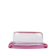 a pink plastic tray with a clear lid on the bottom, and a white background