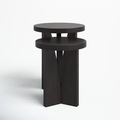 a black table with two circular tables on each side and an open one at the top