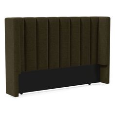 an upholstered headboard with dark green fabric and black wood trimmings