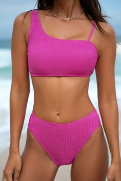 Elevate your swimwear game with the Pink Asymmetrical Bikini Top & Mid Rise Bottom Set. The sleek design and flattering fit are perfect for the modern beach look! Product code: CAA12C4C159WW Features:  Asymmetrical neckline  Adjustable straps  Removable soft cups  Mid rise  Modern leg high Modern-cheeky bum coverage Wash Method: Hand Wash Material: 95%POLYESTER,5%SPANDEX. Solid One-shoulder Swimwear For Beach Season, One Shoulder Beach Swimwear, Summer Asymmetrical Swimwear For Beach Season, Asymmetrical Swimwear For Beach, Asymmetrical Beachwear Swimwear For Beach, Fitted Asymmetrical Swimwear For Beach, Asymmetrical Fitted Swimwear For The Beach, Asymmetrical Beachwear Swimwear, Solid Swimwear With Asymmetrical Neckline For Pool