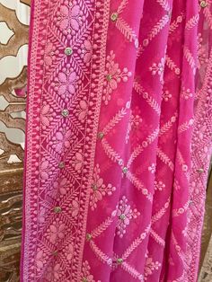 A very very pretty Chikankari saree in pure georgette in a lovely candy pink shade with all over jaal (barfi pattern) embroidery with mukaish work (embellishments). The pallu is short but features intricate designs. The entire saree has the same pattern from the very beginning of the saree except the portion you have to tuck in so that it doesn't bulge. Entire saree is framed in cord piping, best quality satin falls are attached and picot stitching is done as well. The blouse piece is separated Festive Pink Saree With Intricate Embroidery, Pink Dupatta With Resham Embroidery In Georgette, Pink Georgette Traditional Wear With Cutdana, Pink Semi-stitched Saree With Intricate Embroidery, Pink Resham Embroidered Dupatta, Pink Saree With Intricate Embroidery For Diwali, Pink Dupatta With Intricate Embroidery In Traditional Drape, Pink Georgette Dupatta With Pallu, Pink Georgette Dupatta With Cutdana