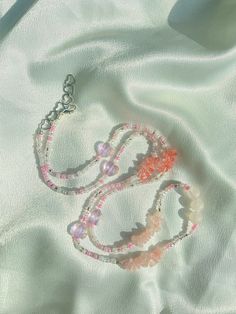 "Made to order clear, white, & pink glass beads with rose quartz and rhodochrosite crystals ✨ Removable and adjustable up to 2\" with a choice of silver or 14k gold clasp.   In the notes please include what length you would like your beads! Measure your waist wherever you want your beads to fall as shown in the listing photo. Rose Quartz 🌹💖 is associated with the heart chakra and is a stone for universal & unconditional love of the self and others. Rhodochrosite 💖 is associated with the heart chakra and is a great stone for healing the heart, and overcoming past wounds and traumas. Custom waist beads are available through message or DM on Instagram! Chakra: Heart All crystals are charged under moonlight of the new moons and cleansed with palo santo before they are mailed." Pink Waist Beads, Photo Rose, Feminine Jewelry, Waist Beads, Belly Chain, Clear White, Quartz Rose, Body Jewellery, New Moon