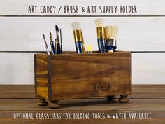 an art caddy / brush and art supply holder with paintbrushes in it