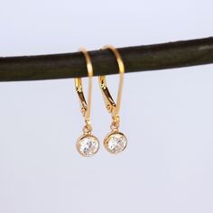 14k Gold Filled Modern Hoop Dangling Disc/Coin Earrings. This beautiful Earrings match with any outfit and comfortable wearing everyday. ★★Choose hoop style from drop down box . see picture no: #2. Then beautiful Earrings consists of -14k gold fill lever back Earrings. -6mm 14k gold fill bezel setting CZ dot necklace , -Come up with ribbon gift box and -One set of Care instruction package. MORE EARRINGS https://www.etsy.com/shop/rainbowearring1?section_id=22425645 Disc / Coin Necklace https://ww Classic Gold Diamond Earrings Hypoallergenic, Yellow Gold Dangle Crystal Earrings For Anniversary, Gold Hypoallergenic Dainty Diamond Earrings, Gold Dainty Hypoallergenic Diamond Earrings, Dainty Gold Hypoallergenic Diamond Earrings, Dainty Gold Diamond Hypoallergenic Earrings, Gold Hypoallergenic Diamond Earrings, Gold Diamond Earrings With Ear Wire For Gift, Gold Teardrop Diamond Earrings With Vvs Clarity