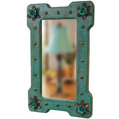 a mirror that has some flowers on it