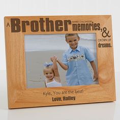 a personalized wooden frame with an image of two children holding hands and the words, brother