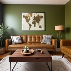 a living room with green walls and leather furniture