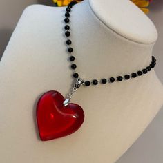 Black Beaded Necklace With Big Large Red Glass Crystal Heart Pendant Charm Brand New Big Red Crystal Glass Heart Charm Pendant Choker Necklace 3d Heart Pendant Chunky Heart Necklace Super Adorable Necklace, You Will Love The Contrast Between The Red Heart And The Black Of The Beads. *Glass Heart Pendant Size: 43mm *Necklace Length: 34cm+5cm Extension Chain. *Brand New. *Will Ship Next Day Or Same Day If Possible. *Make A Bundle Of 2 Or More Items And Save $2 (Message Me First!) #Bigredcrystalheartnecklace##Glassheart#Heartpendant Tags: Fairycore Jewelry Handmade Necklace Handmade Jewelry Cottagecore Healing Crystals Crystal Jewelry Crystal Necklace Boho Witchy Pixie Fae Boho Unisex Chunky Heart Necklace, Jewelry Cottagecore, Fairycore Jewelry, Black Beaded Necklace, Pendant Choker Necklace, Crystal Heart Necklace, Flower Statement Necklace, Black Velvet Choker, Nugget Necklace