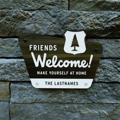 a sign that says friends welcome make yourself at home and the last names on it