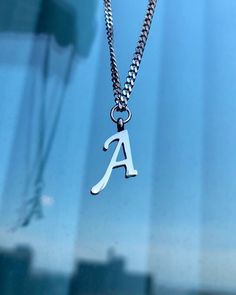 Letter A necklace, set on a stainless steel ,silver color chain. Chain length 18" Beautiful spiritual gift. Please make sure you to pay attention to the size of the pendant. I have added pictures next to 25 cent coin, and measurement tape.  Need a different length just write it to me in the "message to the seller" box of the order form. **LIMITED SUPPLY** All of our jewelry comes wrapped and ready for gift giving! To see more, please visit my shop at http://www.etsy.com/ca/shop/BadassjewelryToro Custom Name Silver Charm Necklaces, Trendy Silver Charm Necklaces With Custom Name, Trendy Silver Name Necklace As Gift, Trendy Silver Name Necklace For Gift, Silver Minimalist Initials Name Necklace, Minimalist Silver Initials Name Necklace, Trendy Silver Custom Name Necklaces, Trendy Silver Name Necklace, Trendy Silver Name Necklace As Personalized Gift