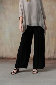 You'll swoon over our Madelyn Pants, where luxurious Italian silk meets impeccable design. These pants feature a comfortable waistband and a flattering wide-leg cut, offering a perfect blend of elegance and ease. Available in stunning colorways that seamlessly coordinate with our effortless tops and cozy knitwear, the Madelyn Pants make full-body dressing an art form. Part of our mix-and-match Italian Silk assortment. Classic fit. One size fits most. Full-length wide-leg pant, foldable jersey wa Versatile Ankle-length Viscose Wide Leg Pants, Elegant Ankle-length Relaxed Fit Harem Pants, Black Full Length Viscose Bottoms, Elegant Relaxed Fit Viscose Bottoms, Versatile Relaxed Fit Viscose Pants, Elegant Rayon Ankle-length Wide Leg Pants, Elegant Ankle-length Wide Leg Rayon Pants, Chic Solid Color Relaxed Fit Harem Pants, Elegant Ankle-length Harem Pants For Loungewear