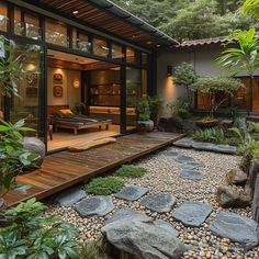 an outdoor living area with rocks and plants