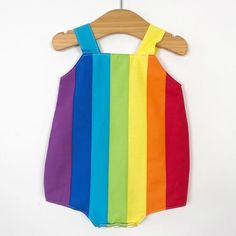 Baby rainbow romper. Poppers for easy changing, relaxed fit, plenty of room for nappies (cloth or disposable). Fully lined with light soft cotton. Seamless insides making them comfortable against babies skin. Rainbow design made up of carefully selected colours of 100% premium quality cotton. Adjustable length straps. Multicolor Cotton Onesie For Summer, Summer Multicolor Cotton Onesie, Multicolor Cotton Playtime Bodysuit, Multicolor Cotton Bodysuit For Playtime, Cute Multicolor Jumpsuits And Rompers For Playtime, Cute Multicolor Playtime Bodysuit, Cute Multicolor Cotton Bodysuit, Multicolor Sleeveless Playwear Bodysuit, Playful Multicolor Bodysuit For Playtime