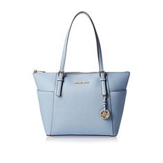 Michael Kors Jet Set Pale Blue Leather Tote Bag Timeless and trendy, the Jet Set tote by MICHAEL Michael Kors is a sleek accessory that's roomy enough to keep all your essentials organized. Item ships brand new in sealed package with tags. Pale Blue leather Top zip closure Exterior: 2 side slip pockets Interior: 1 back zip pocket, 2 back slip pockets, 1 front padded pocket Double top handles with 8 in drop MK removable charm Goldtone hardware Imported 16" W x 10" H x 4.5" D Leather Imported Zip Tote, Handbags Michael Kors, Kors Jet Set, Leather Tote Bag, Types Of Fashion Styles, Leather Top, Michael Kors Jet Set, Jet Set, Blue Leather