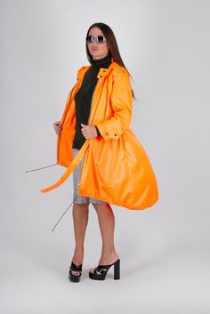 Stay stylish and protected from the wind with our modern windbreaker jacket. Featuring a spacious hood, practical pockets, and a loose fit, it combines fashion with functionality. The adjustable waist tie adds a flattering touch. Perfect for outdoor adventures or urban strolls. Elevate your outerwear collection today! ►Suitable for plus size. The model wears size M - 5,6' / 170 cm ►Materials & Care Made of: Polyester. Machine Wash 30oC, Hand Wash with warm water Medium hot iron  - upper the sigh Modern Oversized Outerwear With Detachable Hood, Modern Nylon Outerwear For Rainy Weather, Hooded Nylon Raincoat With Storm Flap, Modern Windproof Windbreaker For Fall, Modern Windproof Hooded Outerwear, Spring Travel Outerwear Windproof, Utility Windbreaker With Detachable Hood For Rainy Weather, Spring Travel Windproof Outerwear, Hooded Windbreaker With Detachable Hood For Travel