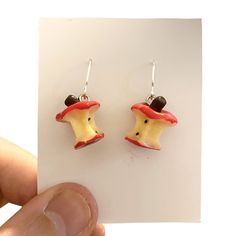 Red Apple Earrings, Novelty Fruit Earrings, Funny Earrings, Weird Earrings, Cool Earrings, Kawaii Earrings, Funky Earrings, Modern Earrings These adorable red apple Earrings will make any outfit that little bit brighter. Simply Gorgeous and so unique and lightweight too. A really fun accessory to compliment anything you wear. These cuties will make the most wonderful gift for someone special. 🍄 SIZE : drop approximately 3cm. 🍄 MATERIALS: resin, silver plated handmade ear wires. 🍄 DESPATCH TIME: Posted next working day. 🍄Your Bonnie Wishes Jewellery will come wrapped in tissue paper with a lovely sticker and will be posted in a strong postal box to ensure your order reaches you in perfect condition. 🍄 I source all my premium quality jewellery findings worldwide, I only use lead and nic Whimsical Red Drop Earrings, Novelty Red Earrings For Gift, Novelty Red Pierced Earrings