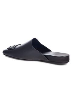 These black Balenciaga BB logo leather slipper shoes feature a square toe, slip-on design, flat sole and BB logo plaque.Calfskin leather with leather soleRubber tap heelMatte black-tone BB logo detail Composition: Leather 100%Lining Composition: Leather 100%Sole Composition: Leather 100% Fits true to sizeMade in Italy Modern Formal Slippers With Leather Sole, Business Slip-ons With Leather Sole, Flat Calf Leather Slip-ons With Leather Sole, Luxury Leather Flat Slip-ons, Flat Calf Leather Mules With Leather Sole, Sleek Calf Leather Slip-on Flats, Modern Flat Slippers With Leather Sole, Black Calf Leather Slip-on Flats, Flat Calf Leather Slip-ons With Rubber Sole