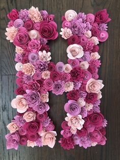 the letter k is made out of paper flowers