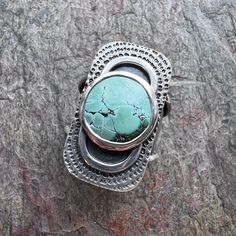 A turquoise cabochon has been set in sterling and fine silver.  I have made this one-of-a-kind ring by sawing, soldering, texturing, and finishing the design entirely by hand.  The silver has been oxidized and polished to create a patina finish. The ring has an internal diameter of 19.2mm and is sized at approximately US size 9.25.  Note that you may want to consider sizing up just slightly for a more comfortable fit since this is a wider band.  The silver has been oxidized and polished to creat Moonstone Ring Sterling Silver, Sterling Silver Rings Turquoise, Lapis Ring, Artisan Rings, Jewelry Picture, Patina Finish, Hammered Sterling Silver, Handmade Rings, Turquoise Rings