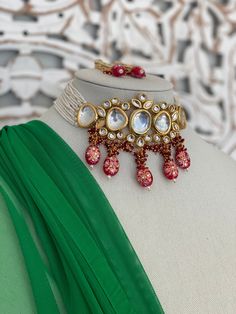 Uncut Pachi kundan choker with earrings/ indian jewelry. Pearl bead work on the side. Lightweight easy to wear.  Goes with traditional Indian dress , saree or western dress.    Style tip- ----------- Pair it with any beautiful traditional outfits  and flaunt with Unique style of collection from us. Perfect match for Festival and Traditional wear.  Take Care Tips-  ---------------- Kee away from perfume, Hair spray and. Moisture.  Store in dry place , Ziplock bag or Airtight box.    Clean with dr Bollywood Kundan Choker Necklace For Festive Occasions, Bollywood Style Kundan Choker For Diwali, Festive Bollywood Style Kundan Choker Necklace, Festive Temple Jewelry Choker With Mirror Work, Festive Kundan Choker With Mirror Work, Festive Kundan Choker For Festivals, Bollywood Kundan Choker With Gota Work, Festive Season Kundan Choker Necklace, Diwali Kundan Chandbali Choker