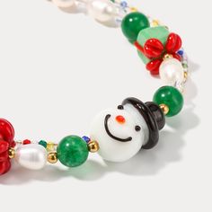 Introducing the Selenichast Snowman Party Bracelet, crafted from glossy brushed aluminum and featuring a captivating snowman charm. A perfect accessory for a night out, it will add a touch of class and elegance to add an alluring, festive feel to any outfit. DETAILS Materials: Glass, Millefiori Glass Beads Measurements: 1 6-22cm Weight: 15g Handmade Jewelry For Christmas Celebration, Festive Beaded Holiday Jewelry, Festive Christmas Bracelets With Round Beads, Christmas Holiday Bracelet Jewelry, Beaded Jewelry Christmas Gift, Christmas Festive Round Beads Bracelets, Christmas Holiday Jewelry Bracelet, Beaded Jewelry For Christmas Gift, Holiday Festive Jewelry Bracelet