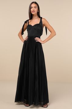 Capture the attention of any cutie in the room with a charming number like the Lulus Attentive Elegance Black Tie-Strap Bustier Pleated Maxi Dress! Lightweight woven fabric (with a subtle sheen throughout) shapes this sweet gown that features a bustier-inspired bodice with seamed cups and a sweetheart neckline, all supported by long tying straps. The high, fitted waist tops a flowy, pleated A-line skirt that gracefully falls to a sweeping maxi hem. Hidden back zipper/clasp. Fit: This garment fit Black Skirt And Top, Black Sweetheart Dress, Knot Tie Dress, Dress With Tie Straps, Fall Wedding Guest Dress, Bridal Party Dresses, Sweetheart Dress, Pleated Maxi Dress, Pleated Maxi