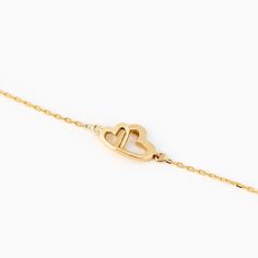 Showcase your love with the Interlocking Heart Bracelet in 14K Solid Gold. This meticulously crafted double heart bracelet for women is the perfect representation of eternal connection and affection. As a piece of 14k gold jewelry, it offers enduring shine and durability. Ideal as a couple bracelet or a thoughtful gift for her, this bracelet seamlessly blends style, sentiment, and quality. Its unique design and solid gold appeal make it a must-have addition to any jewelry collection. 14k solid g Thoughtful Gifts For Her, Bracelet Couple, Couple Bracelet, Couple Bracelets, Double Heart, Recycled Gold, Bracelet For Women, Love Symbols, Heart Bracelet