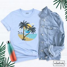 Palm Tree Shirt, Retro Tropical Sunset Shirt, Summer Holiday Shirt, Hawaiian Shirt, Beach Vibes Shirt, Summer Vacation Shirt, Nature Tshirt. Hi! Welcome to our store. It's good to see you here. Our aim is to offer you first-class clothing in your most beautiful moments with our graphic t-shirts that we designed or designed with your ideas. I am sure you will like our designs for your family, friends and you. IMPORTANT MATTERS FOR ORDERING: 1-) Please check and review all photos. 2-) Our sizes ar Cotton Crew Neck Top With Palm Tree Print, Palm Tree Print Graphic Tee With Crew Neck, Summer Cotton Tops With Sublimation Print, Cotton Summer Tops With Sublimation Print, Graphic Tee With Palm Tree Print And Crew Neck, Summer Cotton Shirt With Sublimation Print, Blue Cotton Top With Palm Tree Print, Summer Crew Neck Printed Shirt, Summer Printed Crew Neck Shirt