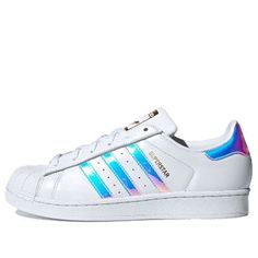 The Adidas Originals Superstar is a timeless classic that has been around since 1969. It is the first low-top basketball shoe to feature a full leather upper and rubber toe cap, which has become its signature look. It was a favorite of almost 3/4 of NBA players in the 70s and has since become a fashion staple across fashion, music, street culture, leisure and sports. The 'Iridescent Hologram' edition features a sleek white upper with a silver sole, making it the perfect combination of style and Sporty Iridescent High-top Sneakers, Iridescent Sporty Sneakers For Streetwear, Sporty Iridescent Sneakers For Streetwear, Iridescent Sneakers With Round Toe For Sports, Casual Iridescent Sneakers For Streetwear, Iridescent Lace-up Sporty Sneakers, Iridescent Low-top Sneakers For Sports, Sporty Iridescent Low-top Sneakers, Iridescent Low-top Sporty Sneakers