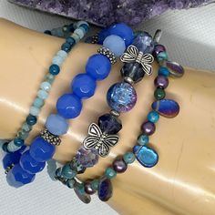 This unique bracelet set is part of my FLUTTER DREAM Collection of jewelry, created in 2023 ~  This collection features themes of flight and fantasy such as butterflies, fairies, dragonflies, & wings, and has a vivid colour story of blue, green, purple, chromatics, iridescence, silver & a touch of gold.  Any or all of the pieces in the entire collection were created to be worn together: Mix and match and have some fun!  Many lovely & unique combinations are possible. Create your own set by choos Blue Whimsical Bracelets For Gifts, Blue Whimsical Bracelets For Gift, Whimsical Blue Bracelets For Gifts, Blue Fantasy Jewelry For Jewelry Making, Handmade Blue Fairycore Jewelry, Fantasy Blue Jewelry For Jewelry Making, Colour Story, Blue Lilac, Butterfly Fairy